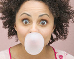 Woman With Curly Hair Eating Chewing Bubble Gum